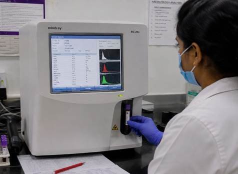 NABL-accredited diagnostic lab in Karnataka showing organised sample processing area with calibrated clinical instruments