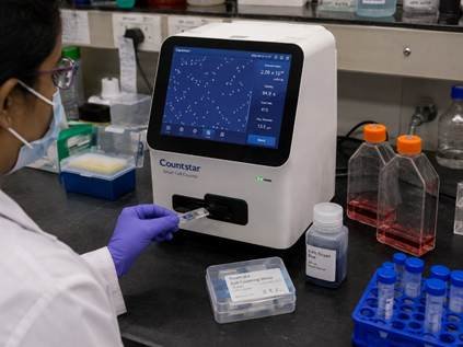 Automated cell counter instrument beside a cell culture flask showing automated cell counter workflow in Bangalore