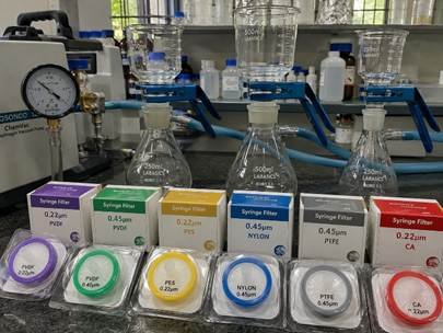 Selection of syringe filters showing laboratory filters membranes types on a Bangalore analytical lab bench